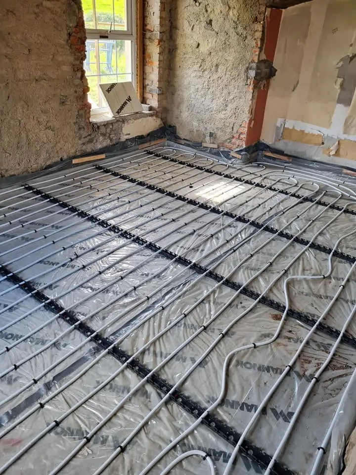 Underfloor heating pipes laid out in a stone cottage renovation in County Cavan
